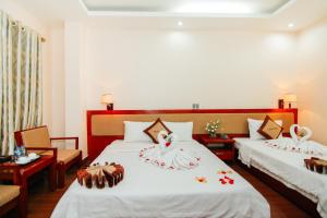 Postel nebo postele na pokoji v ubytování Paradis Hotel