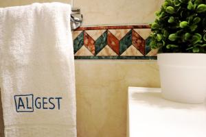 a towel hanging on a rack in a bathroom at Dunas Alvor 211 in Alvor +26 photos