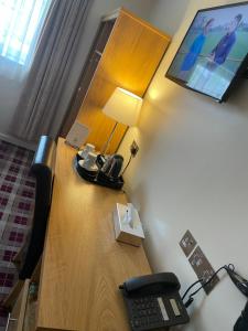 TV a/nebo společenská místnost v ubytování 19th Hole Hotel, Carnoustie