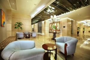 Predel za sedenje v nastanitvi The Grove Suites by Grand Aston