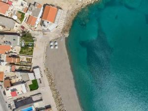 an aerial view of a beach and the ocean at Aria apts 100 m from the beach by PosarelliVillas in Kolymvari