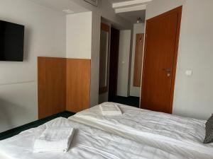 Posteľ alebo postele v izbe v ubytovaní Garbarska 22 Aparthotel