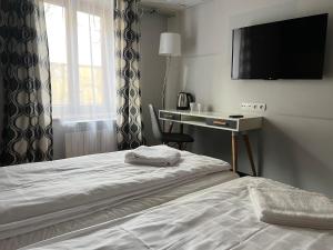 Posteľ alebo postele v izbe v ubytovaní Garbarska 22 Aparthotel + 37 fotografií