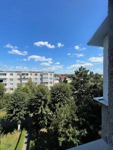 a view of an apartment building from a balcony at Robert's White Apartament in Ploieşti