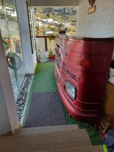 a red bus on the floor of a room at Sunset Valley Holiday Inn in Ooty