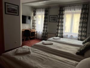 Posteľ alebo postele v izbe v ubytovaní Garbarska 22 Aparthotel