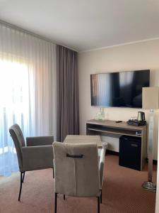 TV a/nebo společenská místnost v ubytování Hotel Neptun