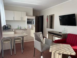 Kuchyň nebo kuchyňský kout v ubytování Hotel Neptun