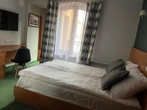 Posteľ alebo postele v izbe v ubytovaní Garbarska 22 Aparthotel