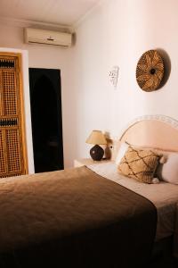 Tempat tidur dalam kamar di Riad Al Tainam