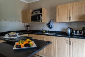 A kitchen or kitchenette at Gooderson Knysna Chalets