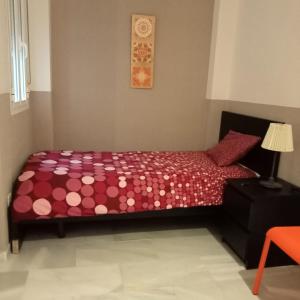 Posteľ alebo postele v izbe v ubytovaní Apartamentos centro histórico