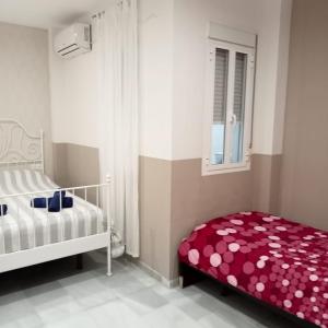 Posteľ alebo postele v izbe v ubytovaní Apartamentos centro histórico