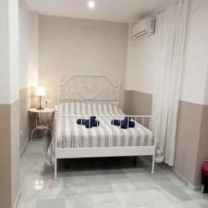 Posteľ alebo postele v izbe v ubytovaní Apartamentos centro histórico