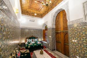Postel nebo postele na pokoji v ubytování Riad Fes Iline