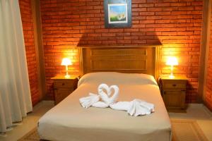 Una cama o camas en una habitación de Sesma Excelencia en Cabañas