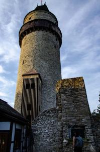 a lighthouse sitting on top of a stone building at Perníkovka in Štramberk