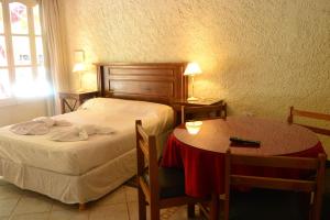 Una cama o camas en una habitación de Sesma Excelencia en Cabañas