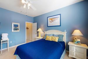 a blue bedroom with a bed and blue walls at Salt Pond -- 13 Skipjack Village in Bethany Beach +22 photos