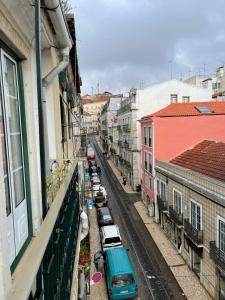 a view of a city street with cars parked at Beautiful apartment downtown Lisbon in Lisbon