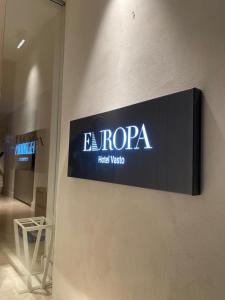 a sign on the wall of a hotel room at EUROPA Hotel in Vasto