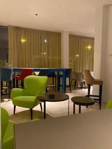 a group of chairs and tables in a room at EUROPA Hotel in Vasto