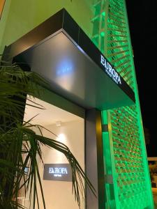 a building with a sign in front of it at EUROPA Hotel in Vasto