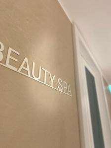 a sign on the side of a wall with the name of a spa at EUROPA Hotel in Vasto