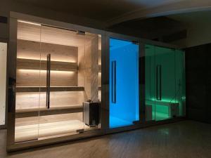 a room with a glass door with blue lights at EUROPA Hotel in Vasto