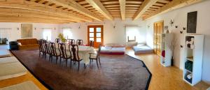 a living room with a table and chairs at Country House Zunko in Jelovec +32 photos