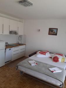 Postel nebo postele na pokoji v ubytování Apartmani Kramar