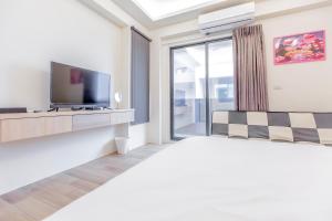 Μια τηλεόραση ή/και κέντρο ψυχαγωγίας στο WOW Penghu Homestay