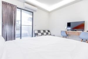 Μια τηλεόραση ή/και κέντρο ψυχαγωγίας στο WOW Penghu Homestay