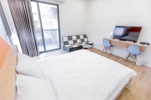 Μια τηλεόραση ή/και κέντρο ψυχαγωγίας στο WOW Penghu Homestay