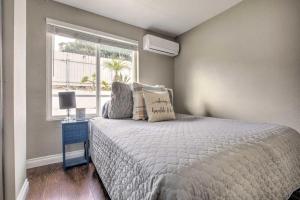 a bedroom with a bed and a window at Relaxing Poway Abode Near Parks and Wineries! in Poway