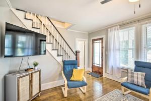 a living room with blue chairs and a tv at Historic Staunton Home about 1 Mi to Downtown! in Staunton