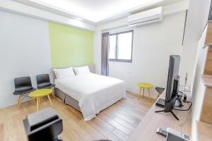 TV a/nebo společenská místnost v ubytování WOW Penghu Homestay