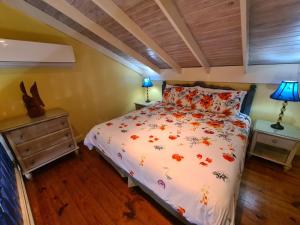 a bedroom with a bed and two night stands with lamps at Chrisanns Paradise Suite by the Ocean - Apt#9 in Ocho Rios