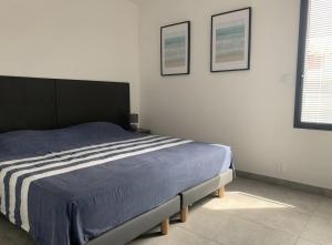 Katil atau katil-katil dalam bilik di Appartement T3 de standing, vue mer - Porticcio