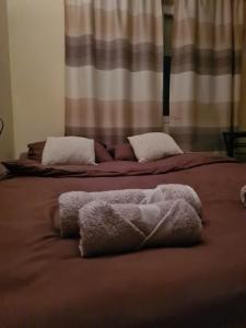 เตียงในห้องที่ Grey & Sunny Apartments Zaječar