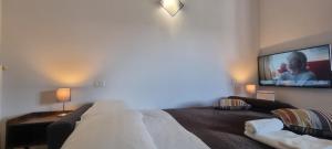 A bed or beds in a room at FGH Mono Locale ZONA FIERA