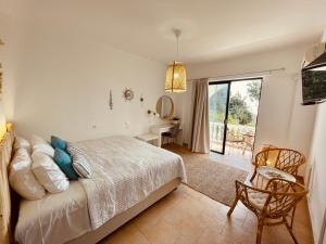 Кровать или кровати в номере Afroditi Junior Suites