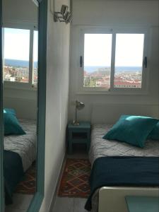 A bed or beds in a room at TORRES DEL SOL 15 floor THE HIGHTEST