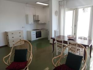 a kitchen with a table and chairs in a room at Le Dimore di Otranto - Altomare in Otranto