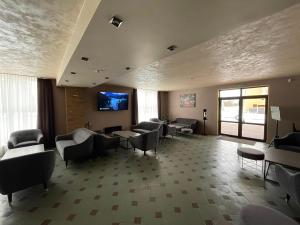TV a/nebo společenská místnost v ubytování VILARHOTEL