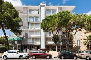 a building with cars parked in front of it at Seaborn Salou in Salou