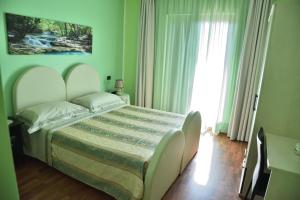 Postel nebo postele na pokoji v ubytování Bed & Breakfast ospiti a corte