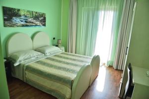 Posteľ alebo postele v izbe v ubytovaní Bed & Breakfast ospiti a corte