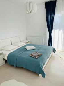 מיטה או מיטות בחדר ב-Galaxy Residence Villa