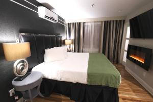 מיטה או מיטות בחדר ב-Hyde Park Hotel